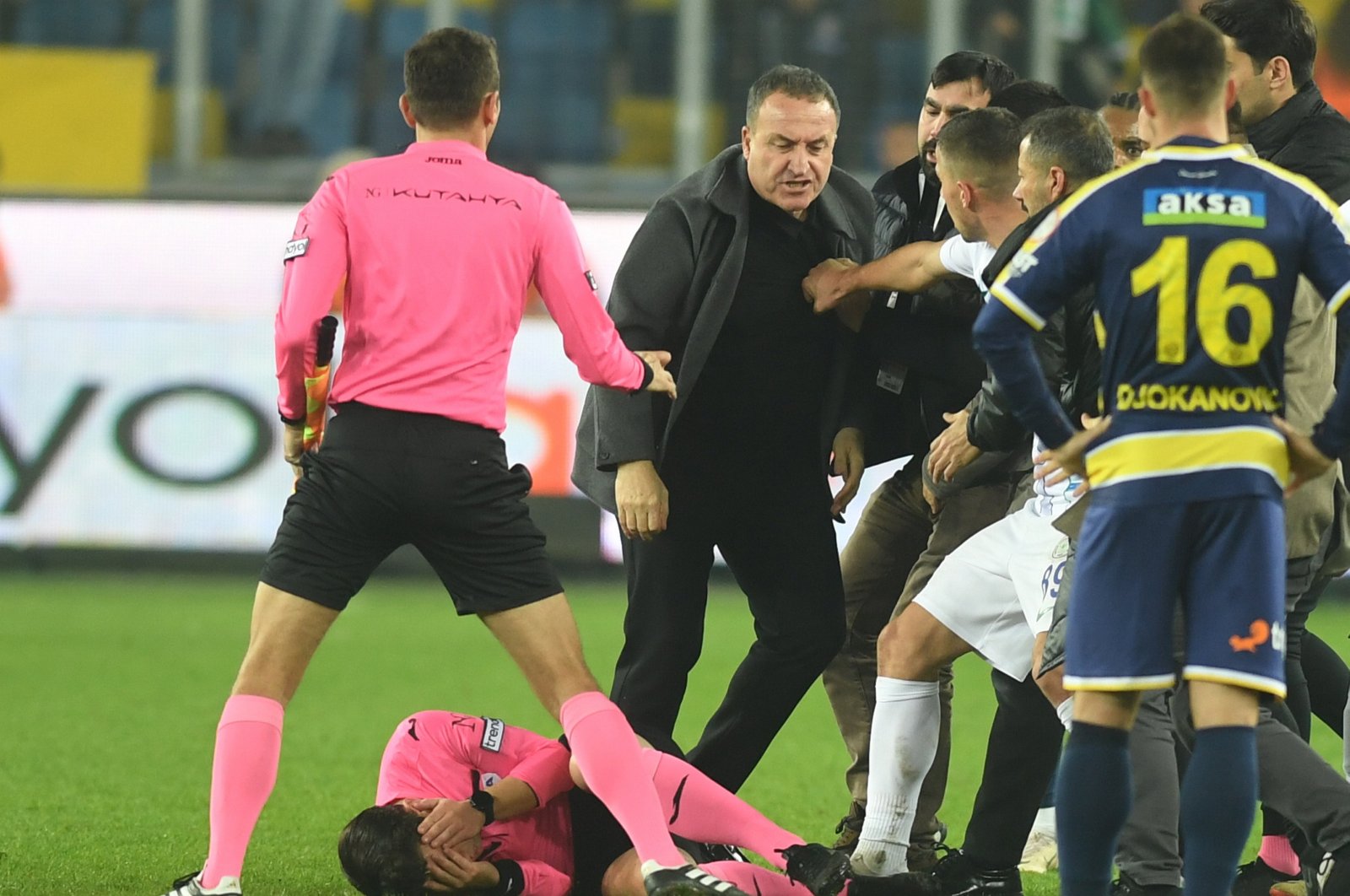 Turkish referee Halil Umut Meler is knocked to the ground after a punch by Ankaragücü's President Faruk Koca (3rd L) after the Turkish Süper Lig match between Ankaragücü and Rizespor, Ankara, Türkiye, Dec. 11, 2023. (EPA Photo)