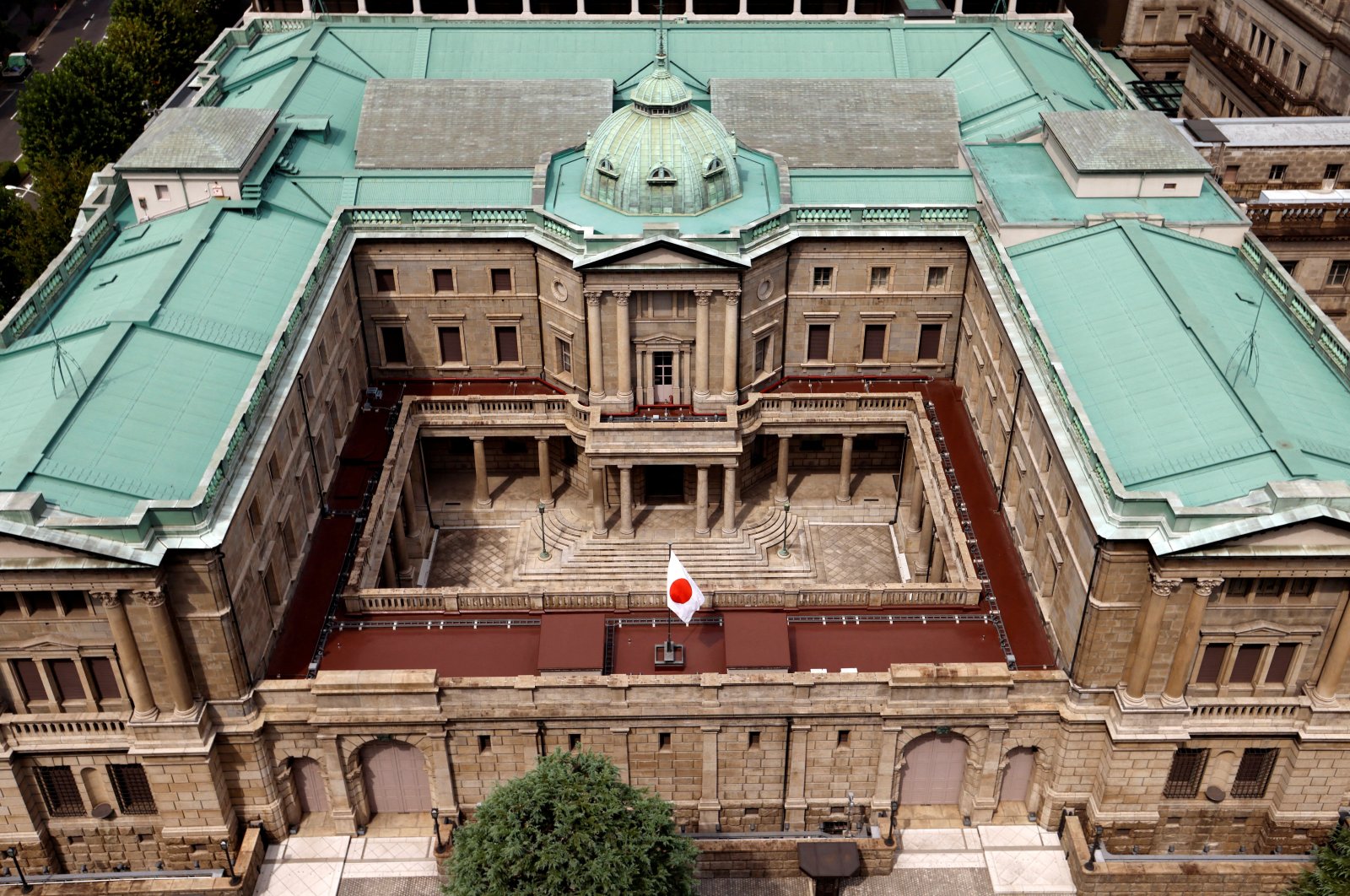 Japanese national flag is hoisted atop the headquarters of Bank of Japan in Tokyo, Japan, Sept. 20, 2023. (Reuters Photo)