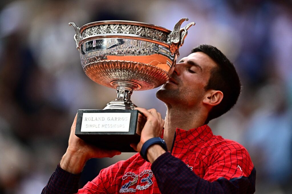 Serbia's Novak Djokovic kisses his trophy as he celebrates his victory over Norway's Casper Ruud during their men's singles final match on Day 15 of the Roland-Garros Open tennis tournament at the Court Philippe-Chatrier, Paris, France, June 11, 2023. (AFP Photo)