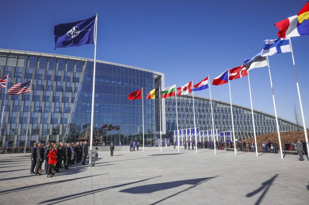 NATO foreign ministers pose during a ceremony to raise the Finnish flag on the sidelines of a NATO foreign ministers meeting at NATO headquarters in Brussels, Belgium, April 4, 2023. (AP Photo)