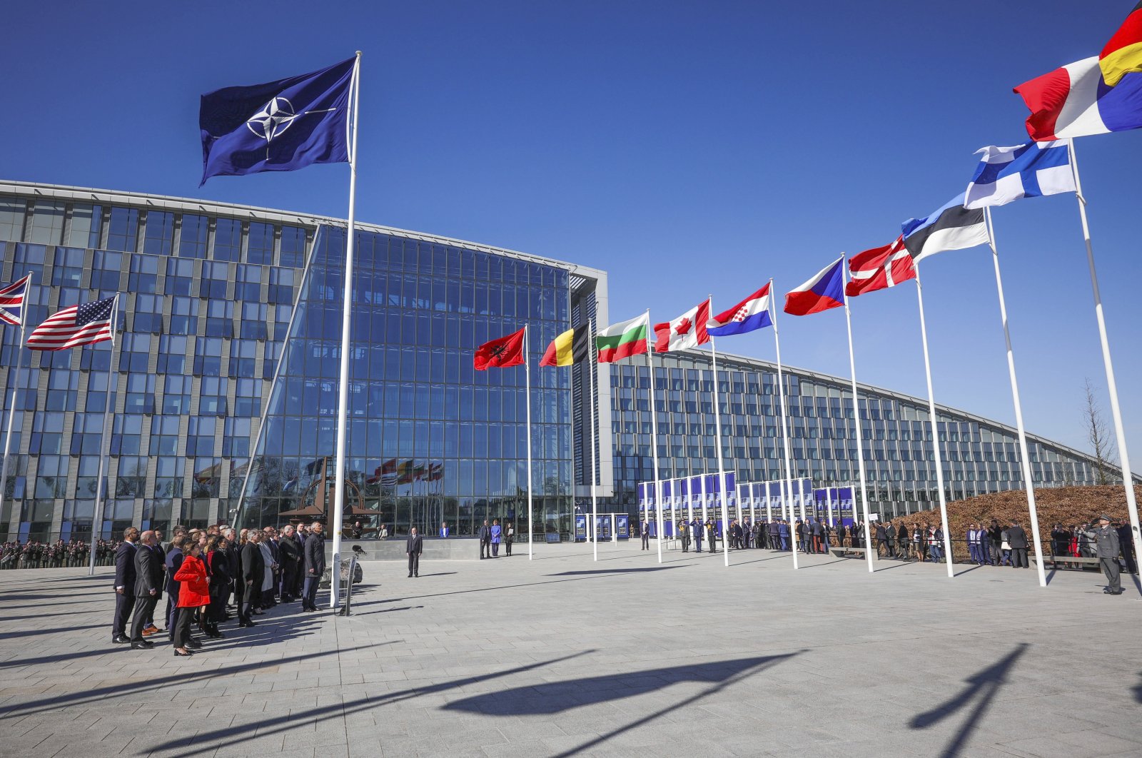 NATO foreign ministers pose during a ceremony to raise the Finnish flag on the sidelines of a NATO foreign ministers meeting at NATO headquarters in Brussels, Belgium, April 4, 2023. (AP Photo)
