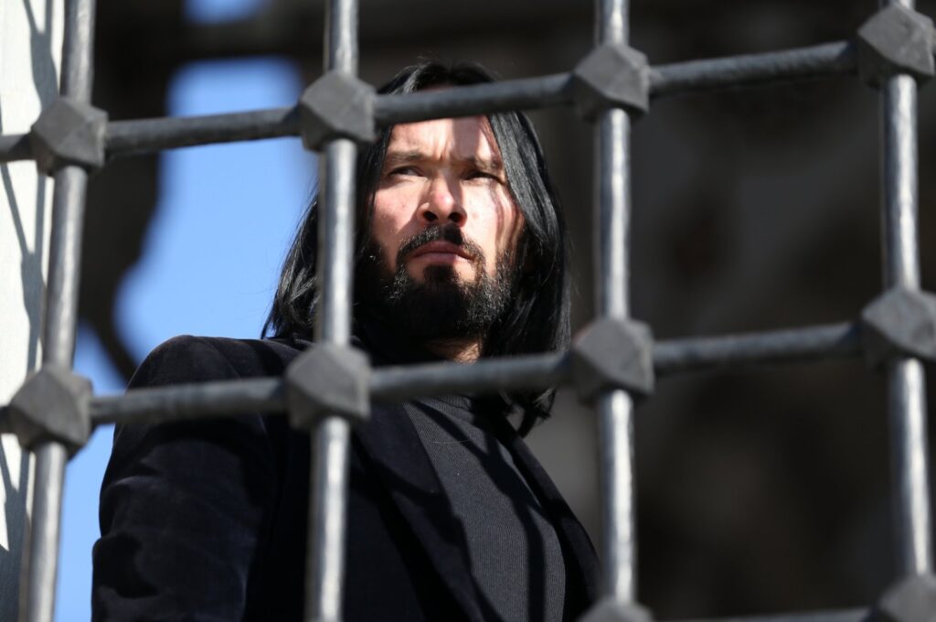 The "Turkish John Wick," Ömer Aslan, looks through a window, Konya, Türkiye, Dec. 20, 2023.