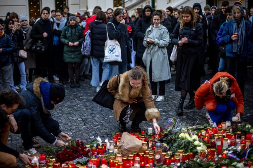 People pay their respects following a mass shooting at one building of the Charles University, in front of the university's main building in central Prague, Czech Republic, Dec. 22, 2023. (EPA Photo)