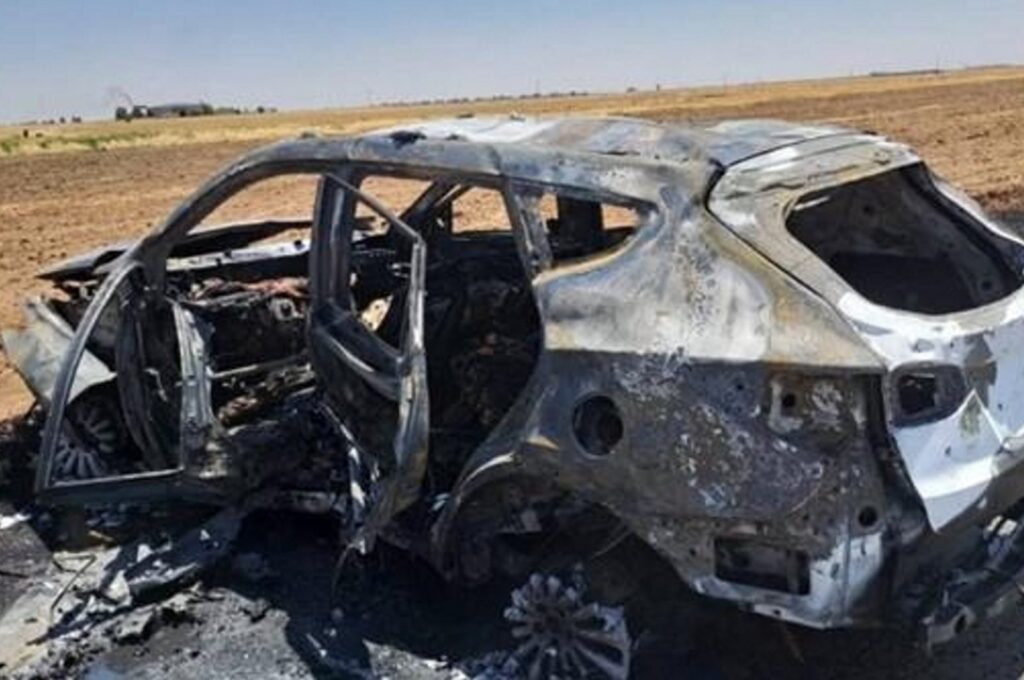 This undated photo taken in an undisclosed location shows the aftermath of a MIT strike targeting the car where "Bahoz Afrin" was traveling. (AA Photo)