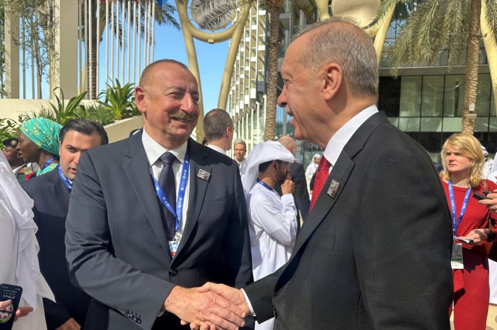 President Recep Tayyip Erdoğan shakes hands with Azerbaijani President Ilham Aliyev on the sidelines of the COP28 summit in Dubai, United Arab Emirates, Dec. 1, 2023. (AA Photo)