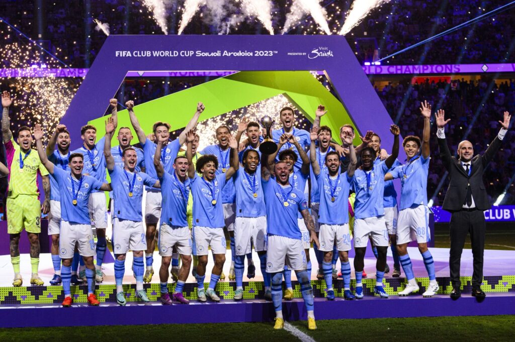 Manchester City squad celebrates with the FIFA Club World Cup trophy after beating Fluminense during the final at King Abdullah Sports City, Jeddah, Saudi Arabia, Dec. 22, 2023. (Getty Images Photo)