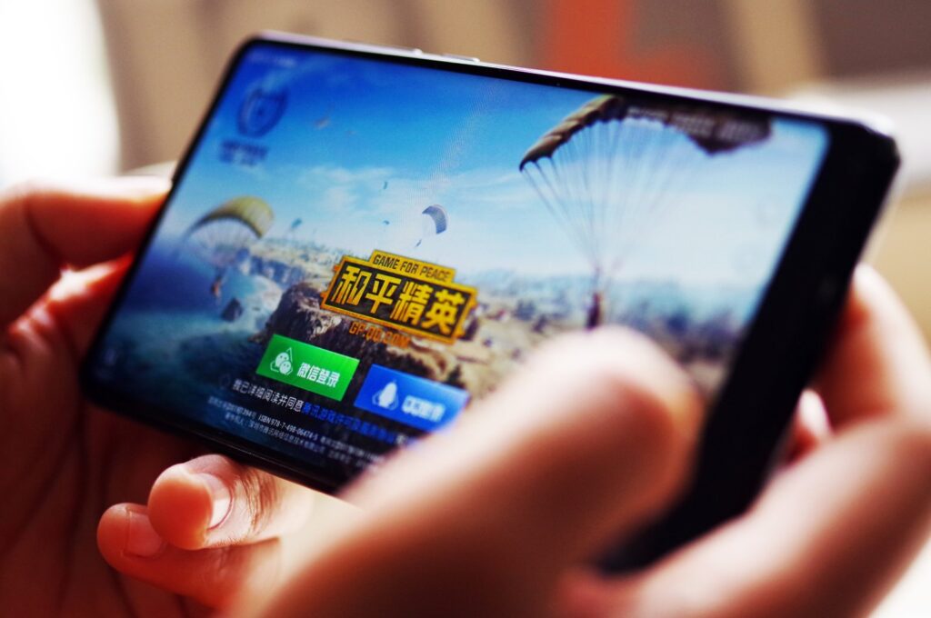 A Chinese mobile game player plays Tencent's "Game for Peace" on his smartphone in Jinan city, Shandong province, China, May 8, 2019. (Reuters Photo)