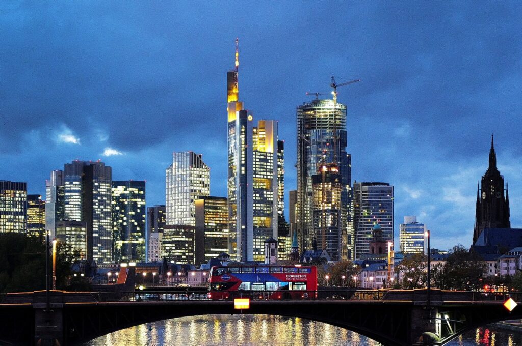 A double-decker bus passes the skyline with its dominating banking district in Frankfurt, Germany, Nov. 8, 2023. (Reuters Photo)