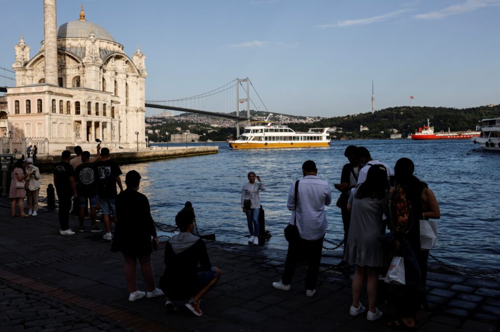 Tourists enjoy the shore of the Bosporus in the Ortaköy neighborhood of Istanbul, Türkiye, May 26, 2021. (Reuters Photo)