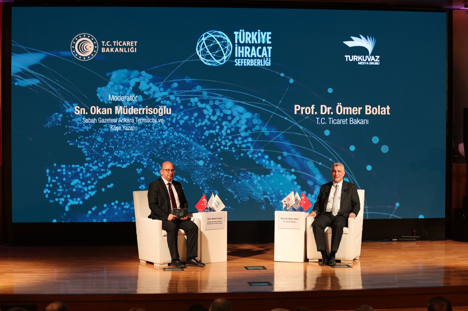 Trade Minister Ömer Bolat (R) speaks during the Türkiye Export Mobilization Summit, organized by Turkuvaz Media Group, in Gaziantep, southeastern Türkiye, Dec. 26, 2023. (AA Photo)