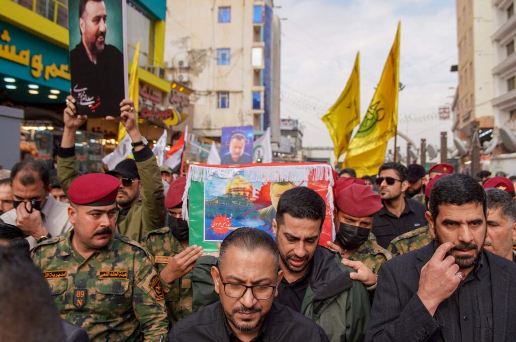 Honor guards carry the coffin of Razi Moussavi, a senior commander in the Quds Force of Iran's Islamic Revolutionary Guard Corps (IRGC) who was killed on Dec. 25 in an Israeli strike in Syria, during his funeral procession at the Imam Ali shrine in Iraq's holy city of Najaf, on Dec. 27, 2023. (AFP Photo)