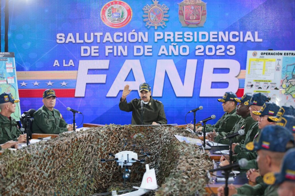 Venezuela's President Nicolas Maduro (C) delivers a speech next to Defense Minister Vladimir Padrino Lopez (L) during a meeting with members of the Bolivarian National Armed Forces (FANB) in Caracas, Venezuela, Dec. 28, 2023. (AFP Photo)