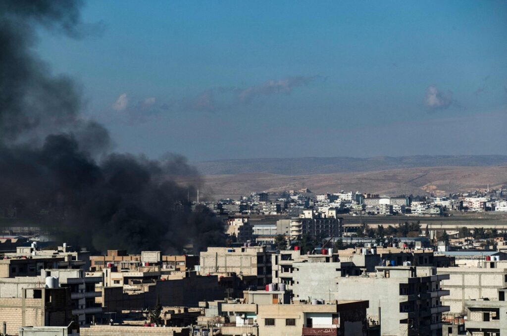 Smoke billows in Qamishli in northeastern Syria close to the Turkish border on Dec. 25, 2023, amid Turkish counterterrorism operations in the area. (AFP File Photo)