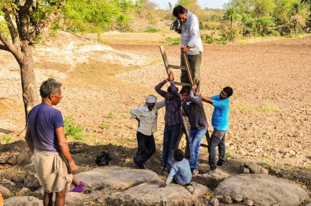 Villagers in India's Madhya Pradesh help a paleontologist photograph a nest of fossilized dinosaur eggs, New Delhi, India, Dec. 27, 2023. (dpa Photo)