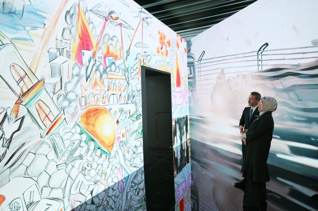 First Lady Emine Erdoğan is seen at an exhibition on Gaza together with Communications Director Fahrettin Altun in Istanbul, Türkiye, Dec.30, 2023 (IHA Photo)