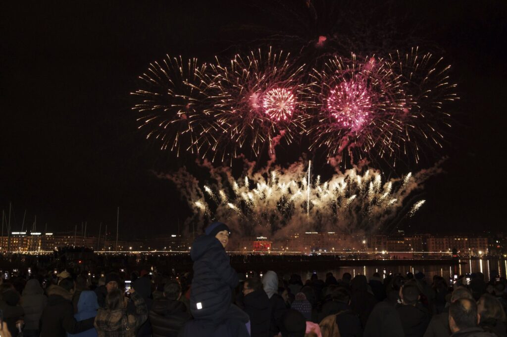 Fireworks illuminate the sky in the bay of Geneva during New Year's celebrations in Geneva, Switzerland, Jan. 1, 2024. (AP Photo)