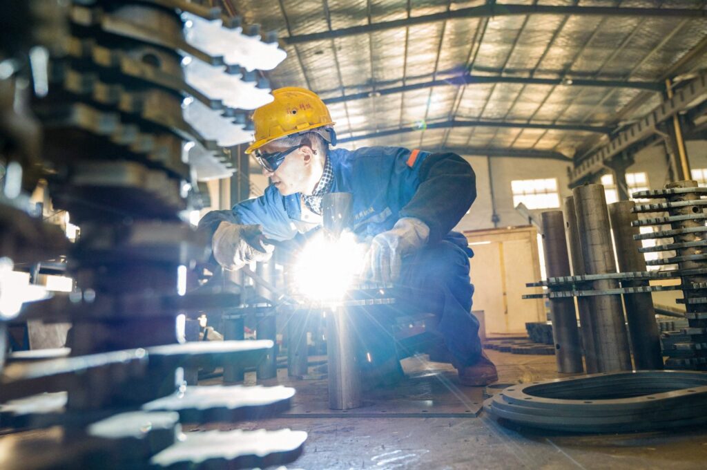 An employee produces building material processing equipment at a factory in Nantong, eastern Jiangsu province, China, Dec. 5, 2023. (AFP Photo)