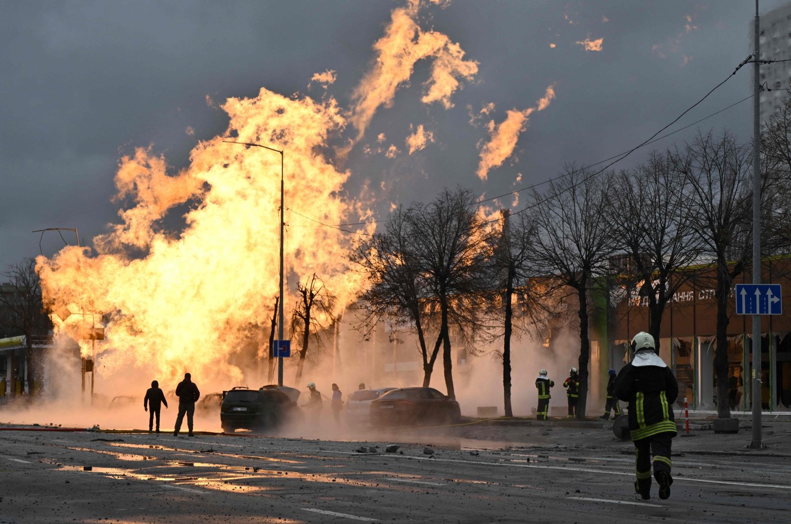 Ukrainian firefighters attempt to extinguish a fire after a missile strike in Kyiv, Ukraine, Jan. 2, 2024. (AFP Photo)