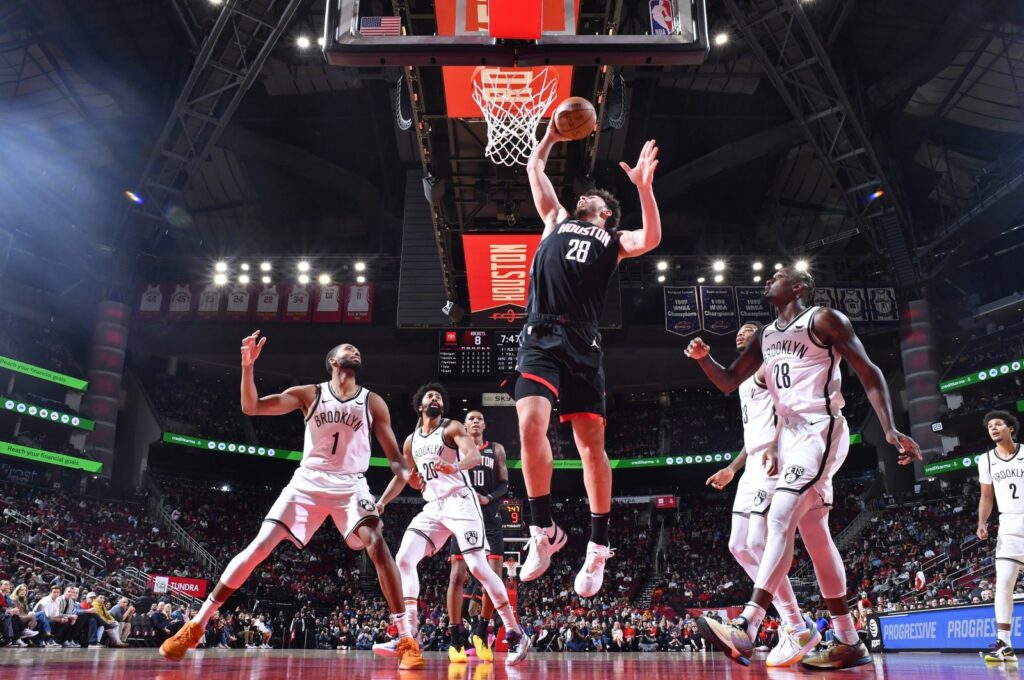 Houston Rockets' Alperen Şengün (C) rebounds during the game against the Brooklyn Nets, at the Toyota Center, Houston, Texas, Jan. 3, 2024. (Getty Images Photo)