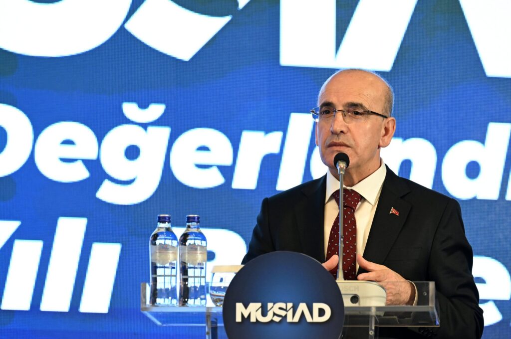 Treasury and Finance Minister Mehmet Şimşek delivers a speech during an annual Independent Industrialists and Businessmen Association (MÜSIAD) meeting in Ankara, Türkiye, Jan. 4, 2024. (AA Photo)