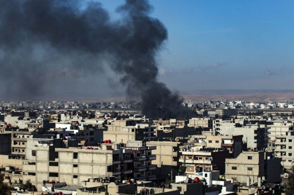 Smoke billows after a Turkish military operation, in Qamishli, northeastern Syria, Dec. 25, 2023. (AFP Photo)