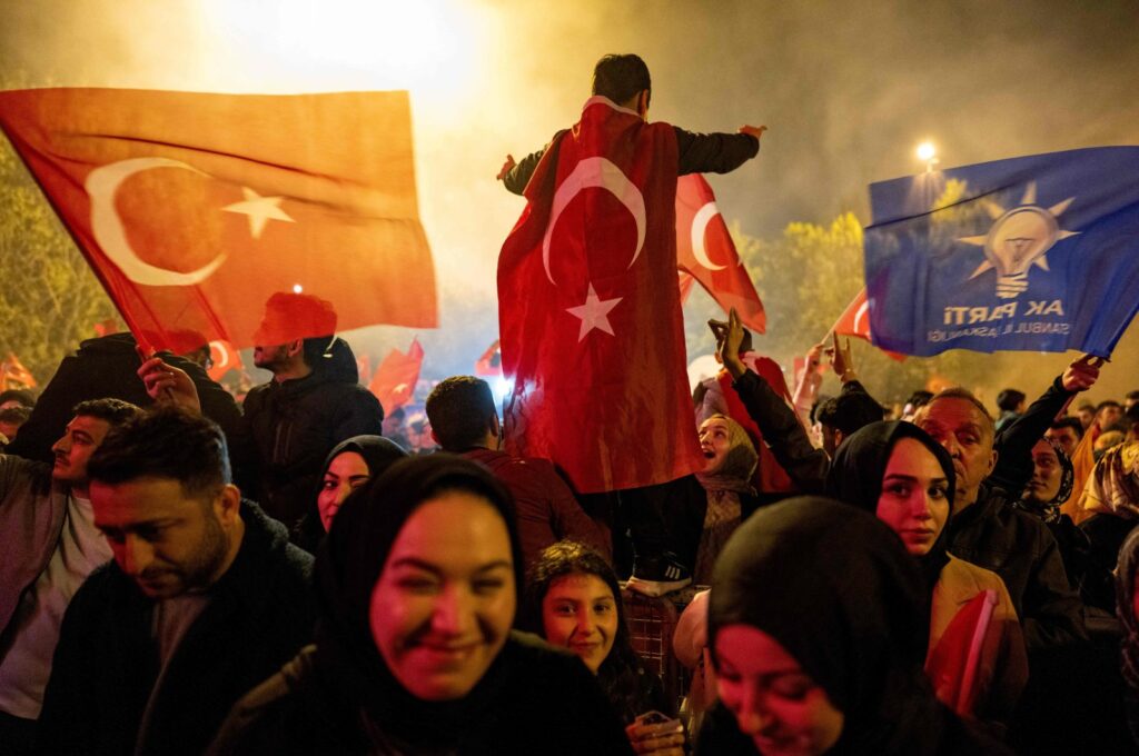 Supporters of President Recep Tayyip Erdoğan wave flags of Türkiye and the Justice and Development Party (AK Party) as they celebrate Erdoğan's victory in a presidential runoff, Istanbul, Türkiye, May 28, 2023. (AFP Photo)
