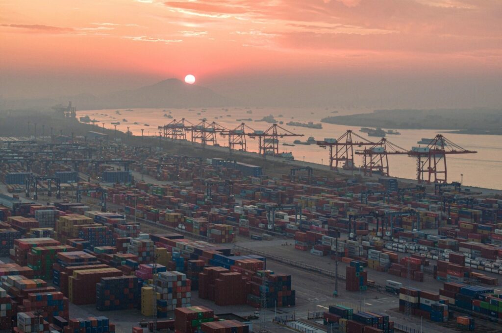 The aerial photo shows shipping containers stacked during the sunset at Nanjing port in China's eastern Jiangsu province, Jan. 4, 2024. (AFP Photo)