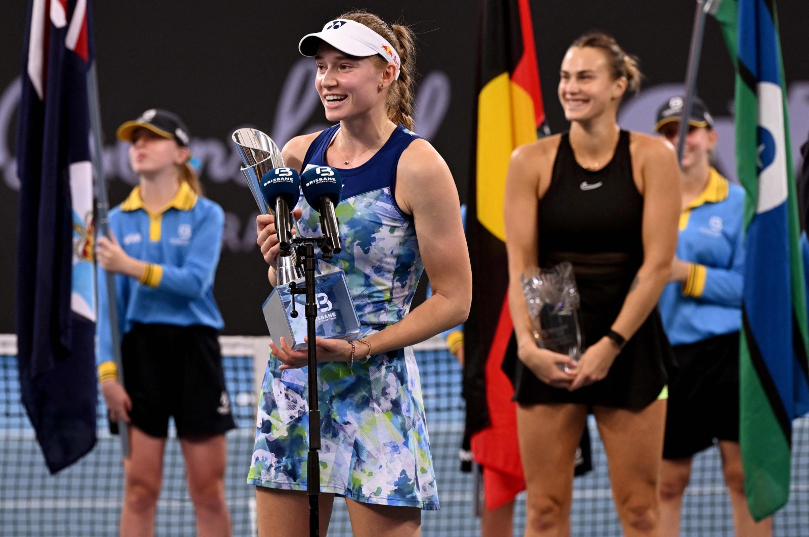 Elena Rybakina of Kazakhstan (L) holds the winner's trophy after the women's singles final against Aryna Sabalenka of Belarus (R) at the Brisbane International, Brisbane, Australia, Jan. 7, 2024. (AFP Photo)