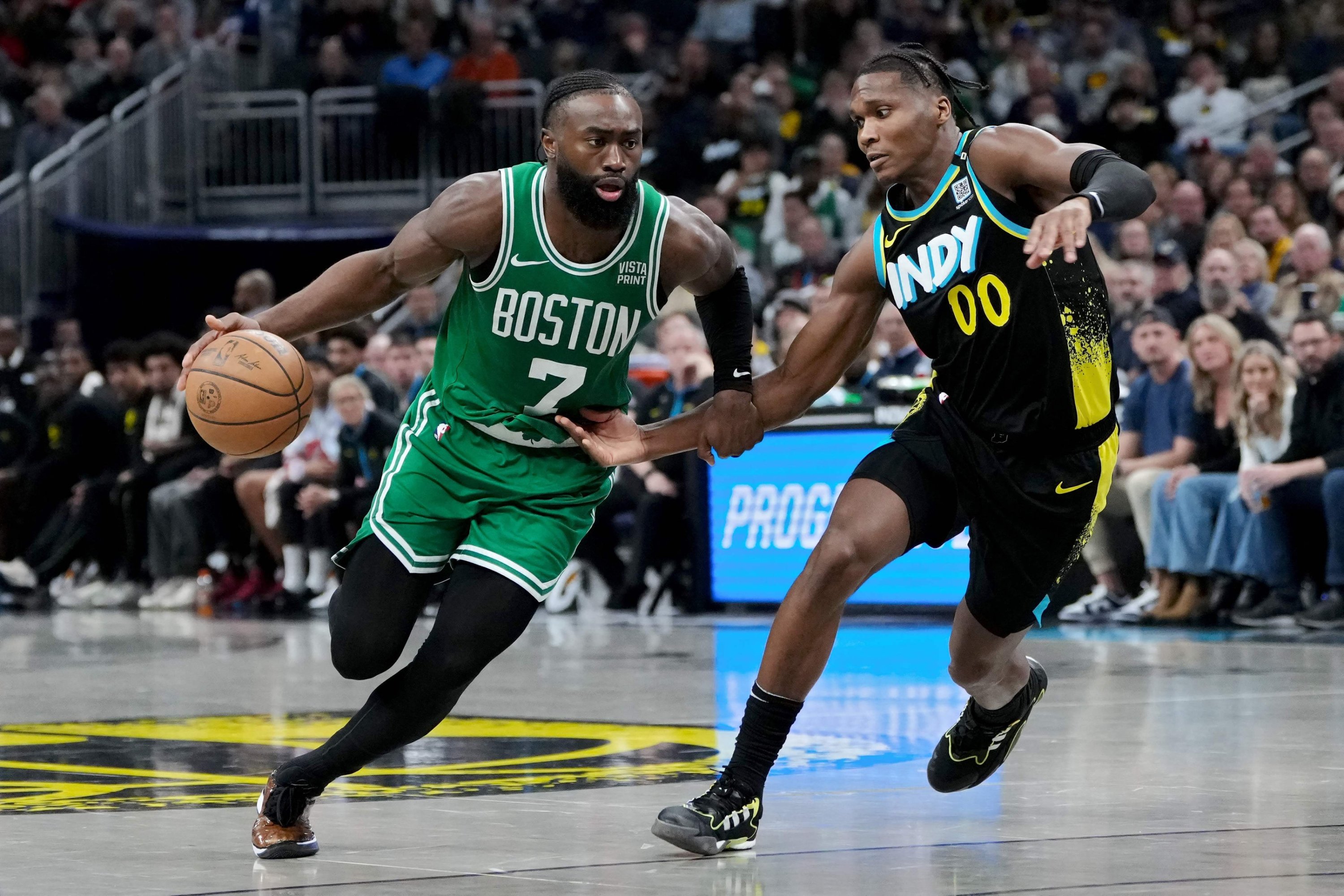 308924 Jaylen Brown (L) of the Boston Celtics dribbles the ball while being guarded by Bennedict Mathurin (R) of the Indiana Pacers at Gainbridge Fieldhouse, Indianapolis, Indiana, U.S., Jan. 6, 2024. (AFP Photo)