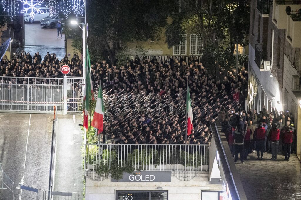 People appear to give the banned fascist salute during a rally in Rome, Italy, Jan. 7, 2024. (AP Photo)