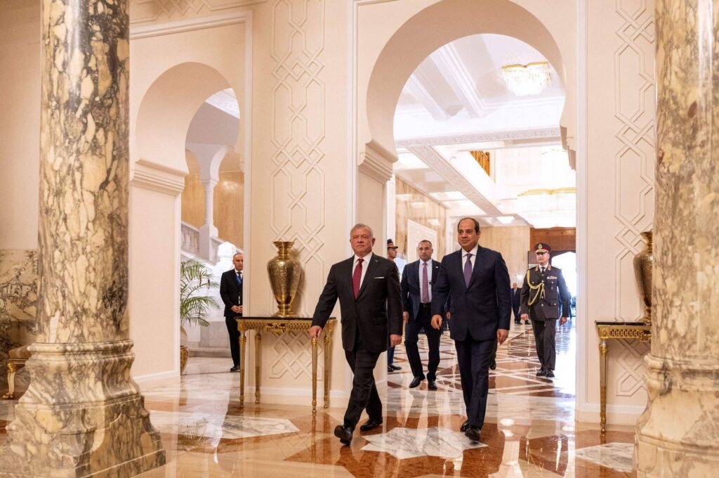 A handout picture released by the Jordanian Royal Palace shows Jordan's King Abdullah II (L) walking alongside Egypt's President Abdel Fattah el-Sissi in Cairo on Dec. 27, 2023. (Photo by Jordanian Royal Palace via AFP)