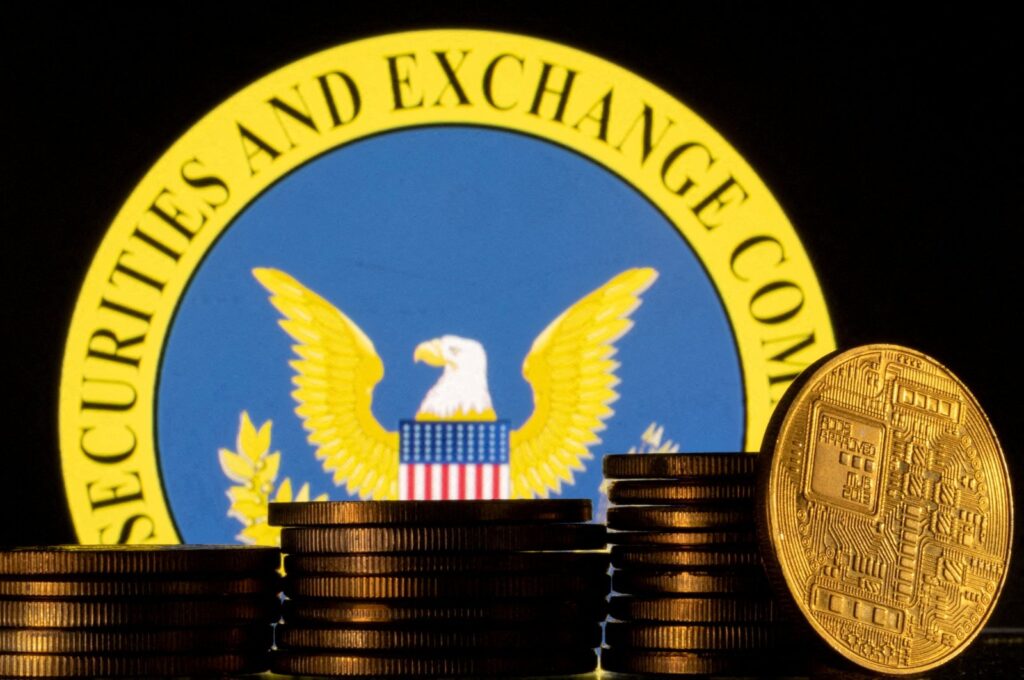 U.S. Securities and Exchange Commission logo and representations of cryptocurrency are seen in this illustration taken June 6, 2023. (Reuters Photo)