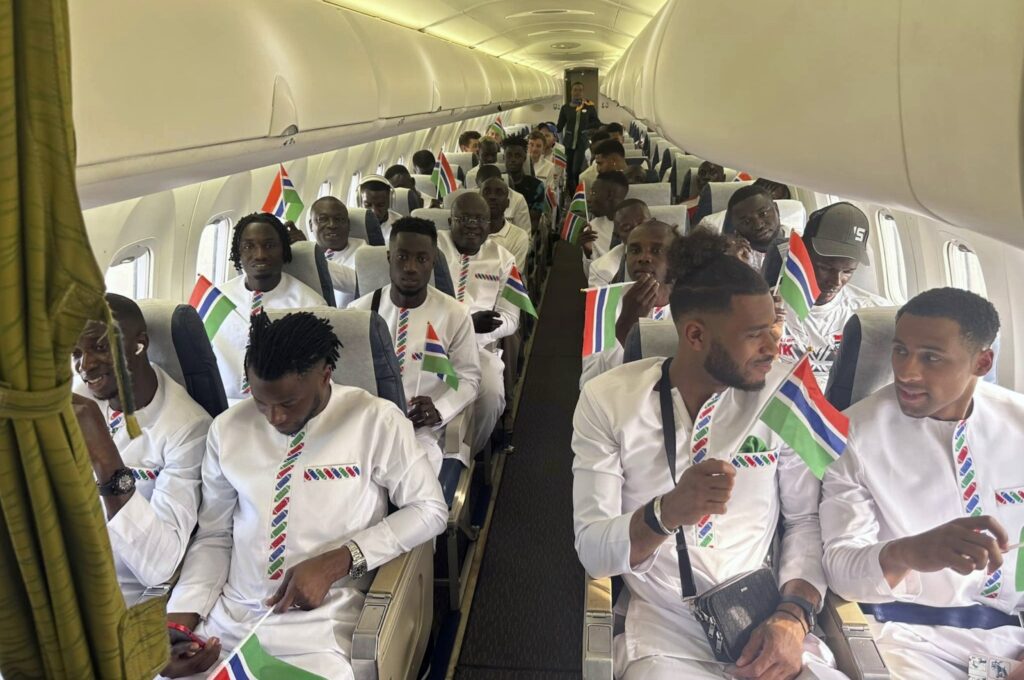 The Gambia national team aboard a plane, Banjul, Gambia, Jan. 10, 2024. (AP Photo)