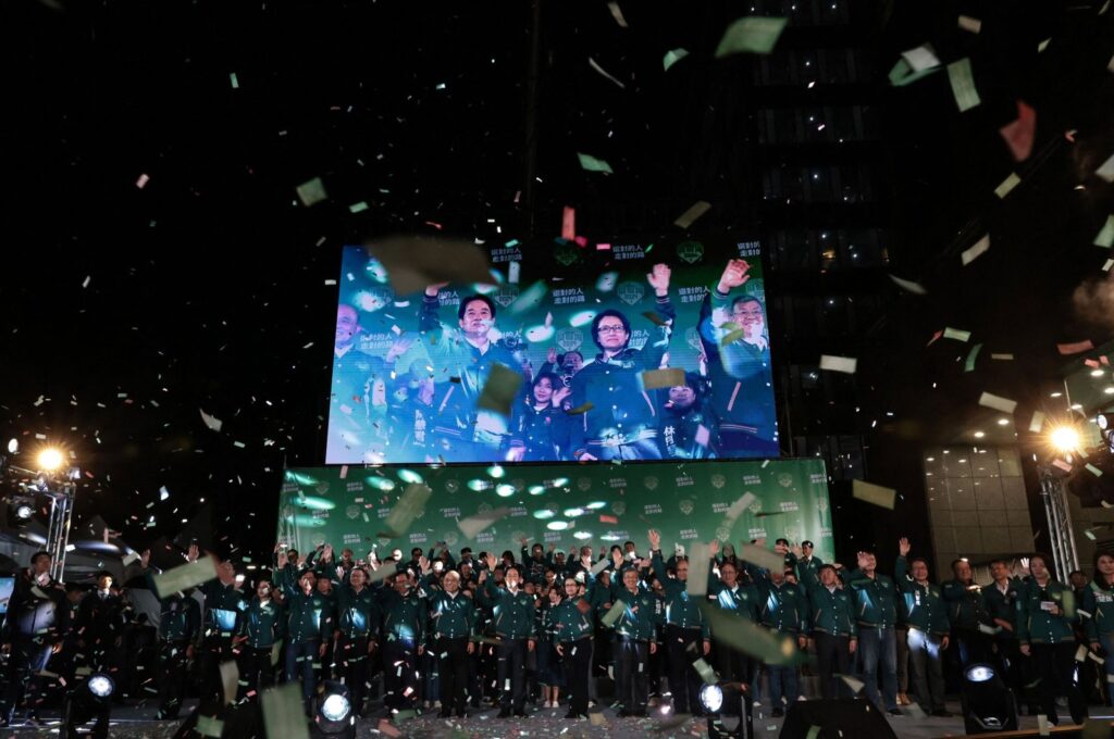 A display shows Taiwan's President-elect Lai Ching-te (L) and his running mate Hsiao Bi-khim attending a rally outside the headquarters of the Democratic Progressive Party (DPP) in Taipei on Jan. 13, 2024. (AFP Photo)