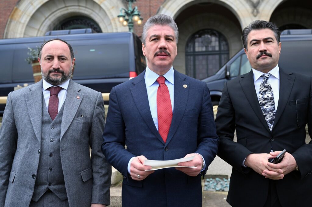 Cüneyt Yüksel, chairman of the Parliamentary Justice Committee and a Justice and Development Party (AK Party) Istanbul deputy, speaks to the press in front of the International Court of Justice (ICJ) in The Hague, Netherlands, Jan.12, 2024 (AA Photo)