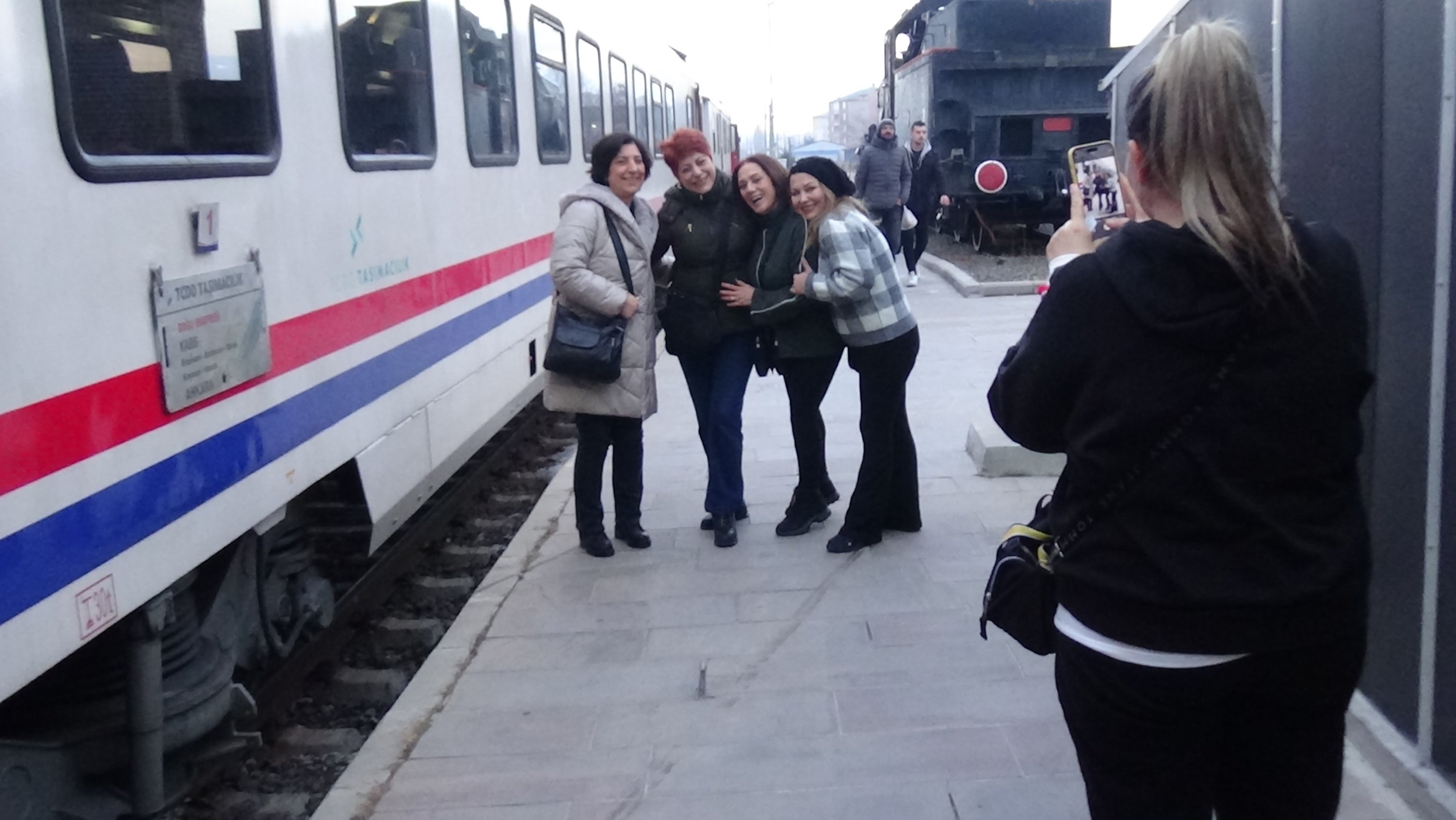 310020 Passengers pose for a photo ahead of Eastern Express journey, Kars, eastern Türkiye, Jan. 14, 2024. (IHA Photo)