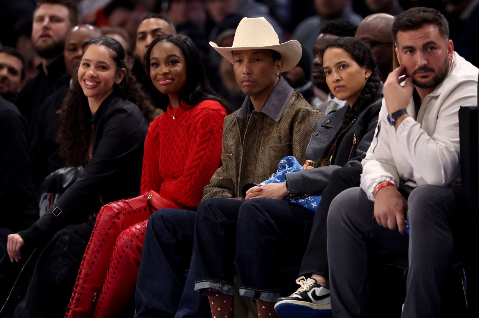 U.S. musician Pharrell Williams (C) attends the NBA regular season basketball match between the Cleveland Cavaliers and the Brooklyn Nets at the Accor Arena, Paris, France, Jan. 11, 2024. (AFP Photo)