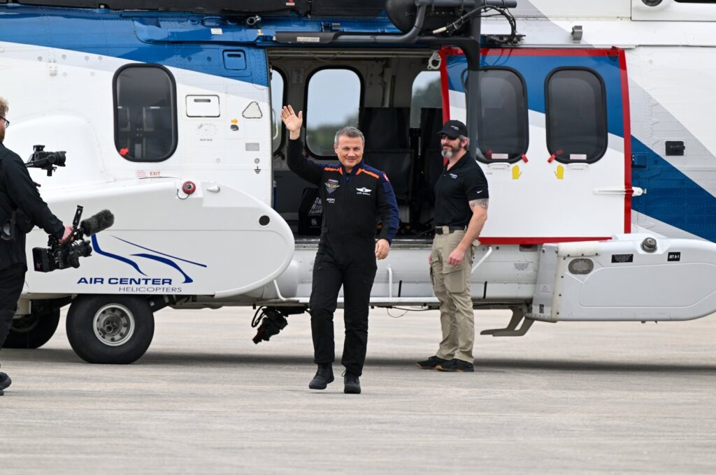 Türkiye's first space traveler Alper Gezeravcı waves to family members as he arrives at the Kennedy Space Center, Florida, the U.S., Jan. 18, 2023. (AA Photo)