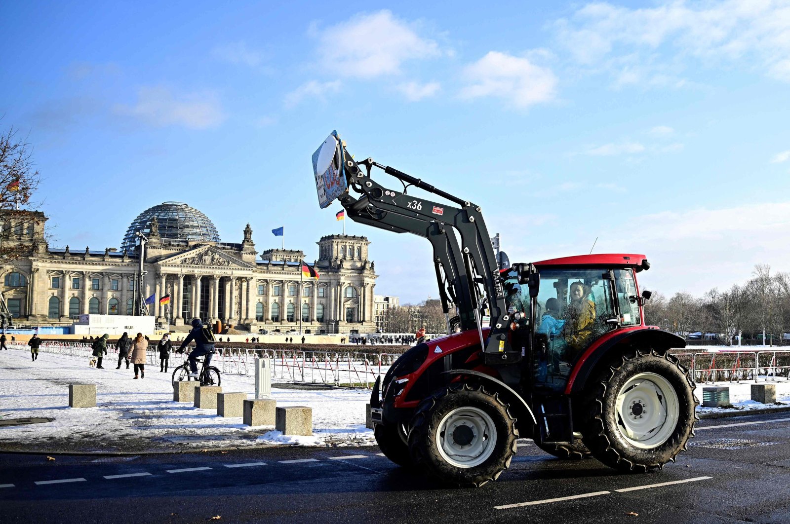 Farmers drive their tractors near the Reichstag building during a protest under the title "We are fed up with agricultural industry" against industrial food production, Berlin, Germany, Jan. 20, 2024. (AFP Photo)