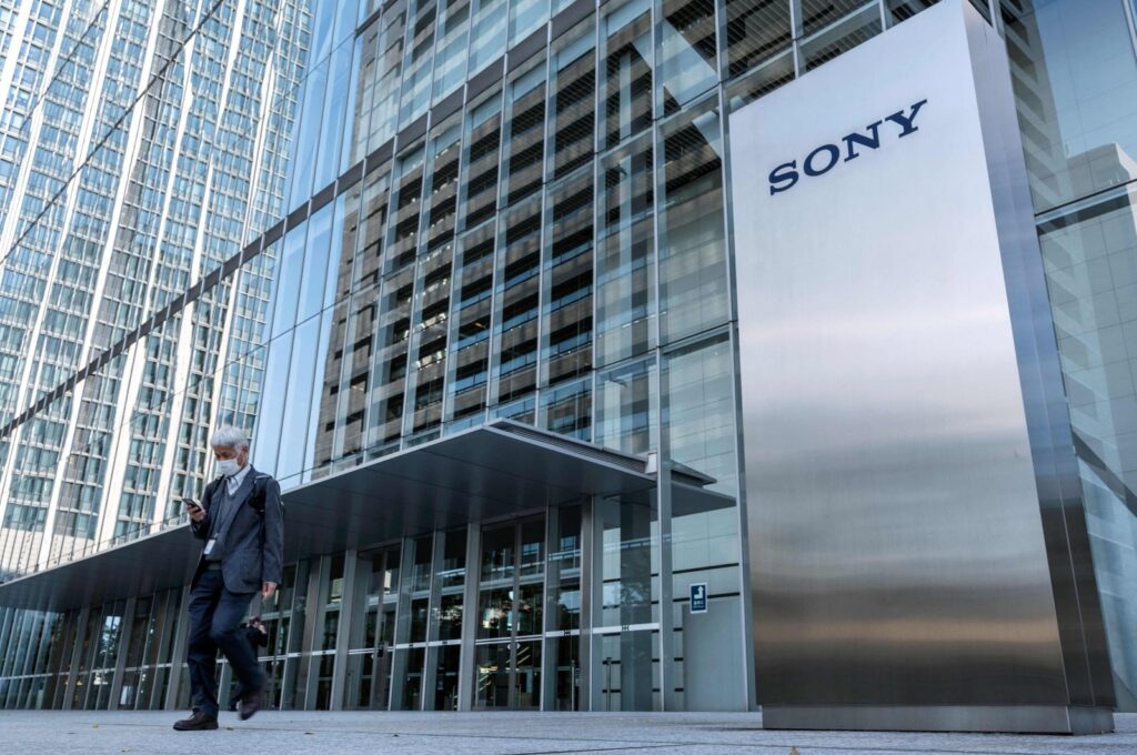 This file photo shows a man walking past the Sony logo outside the company's headquarters in Tokyo, Japan, Oct. 31, 2022. (AFP Photo)