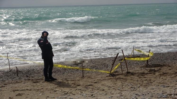 Authorities seal the beach after a body was washed ashore, Antalya, Türkiye, Jan. 21, 2024. (DHA Photo)