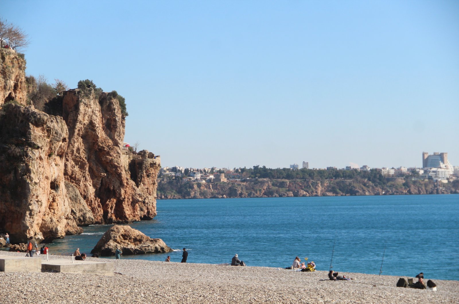 People are seen enjoying at Antalya Beach, Türkiye, Jan. 22, 2024. (IHA Photo)