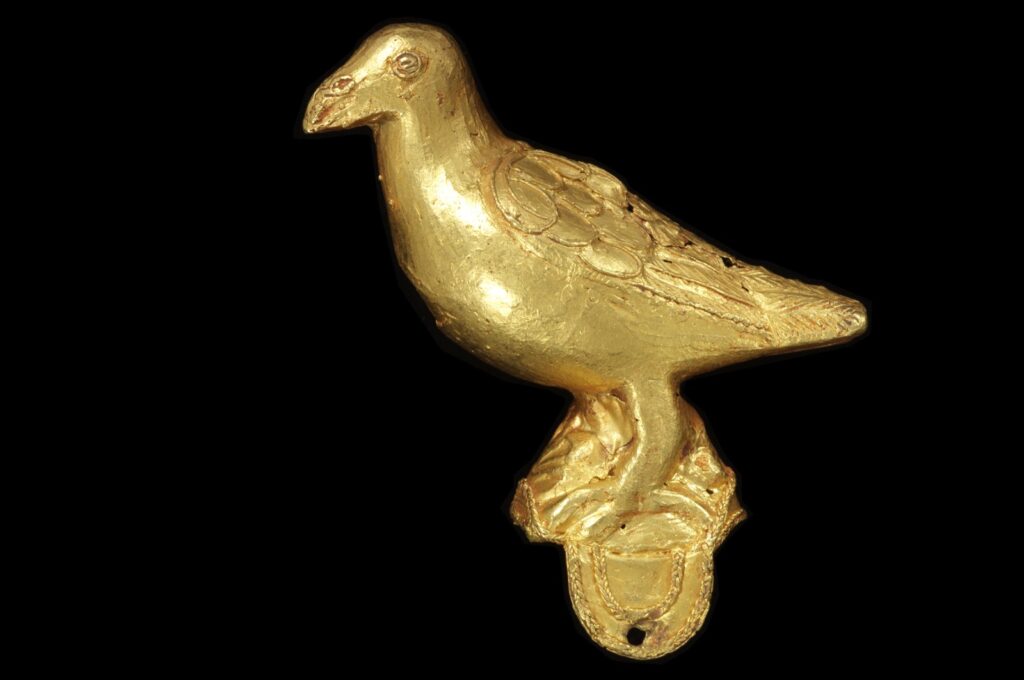 A cast gold ornament, in the form of a bird, probably from a ceremonial hat, originating from Ghana. (AP Photos)