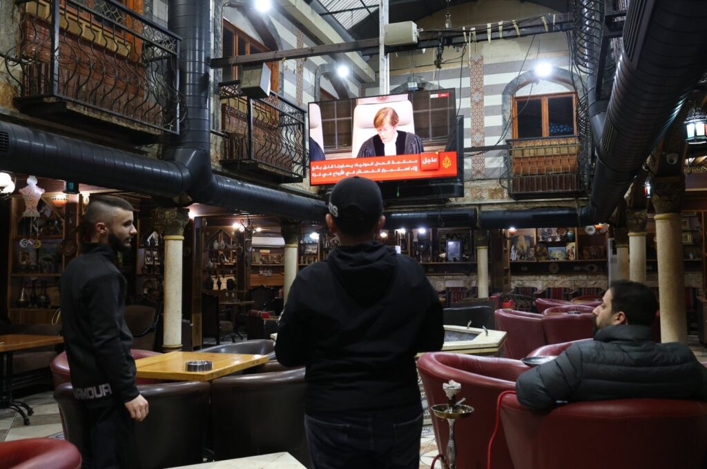 Palestinians watch a live stream from the ICJ in The Hague regarding South Africa's Gaza genocide case against Israel, Jenin, Palestine, Jan. 26, 2024. (EPA Photo)