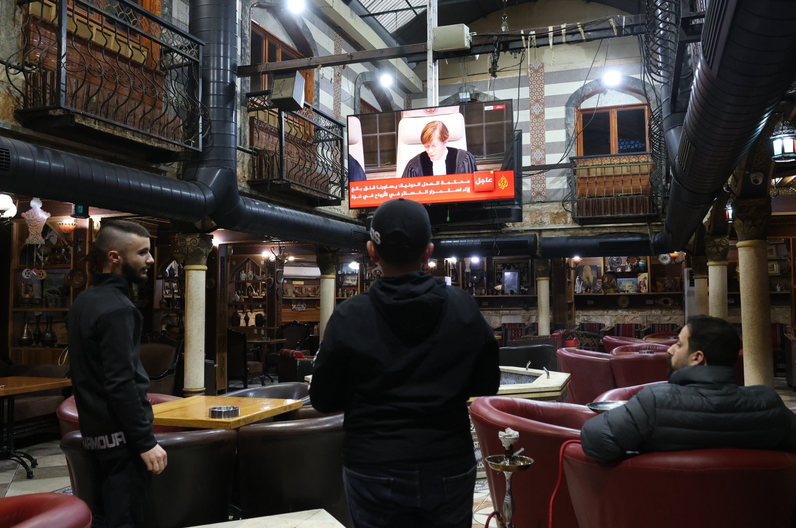 Palestinians watch a live stream from the ICJ in The Hague regarding South Africa's Gaza genocide case against Israel, Jenin, Palestine, Jan. 26, 2024. (EPA Photo)