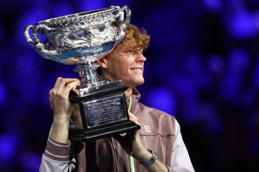 Italy's Jannik Sinner celebrates with the trophy after winning the Australian Open final against Russia's Daniil Medvedev, Melbourne, Australia, Jan. 28, 2024. (Reuters Photo)