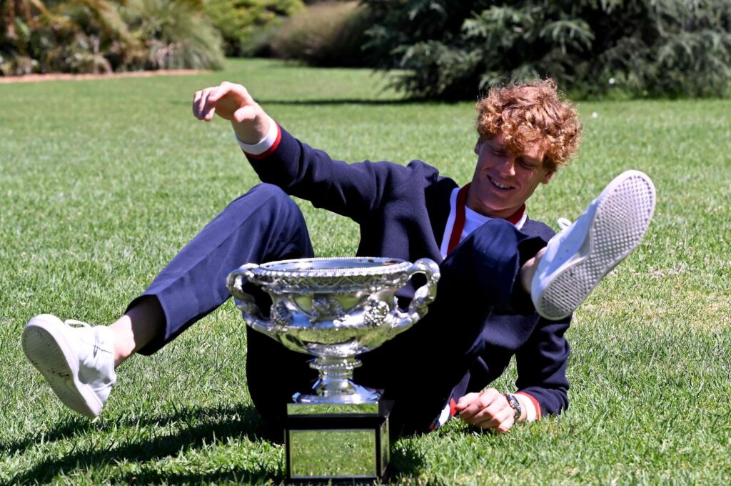 Italy's Jannik Sinner poses with the Norman Brookes Challenge Cup trophy at the Royal Botanic Gardens following his victory against Russia's Daniil Medvedev in the men's singles final of the Australian Open, Melbourne, Australia, Jan. 29, 2024. (AFP Photo)