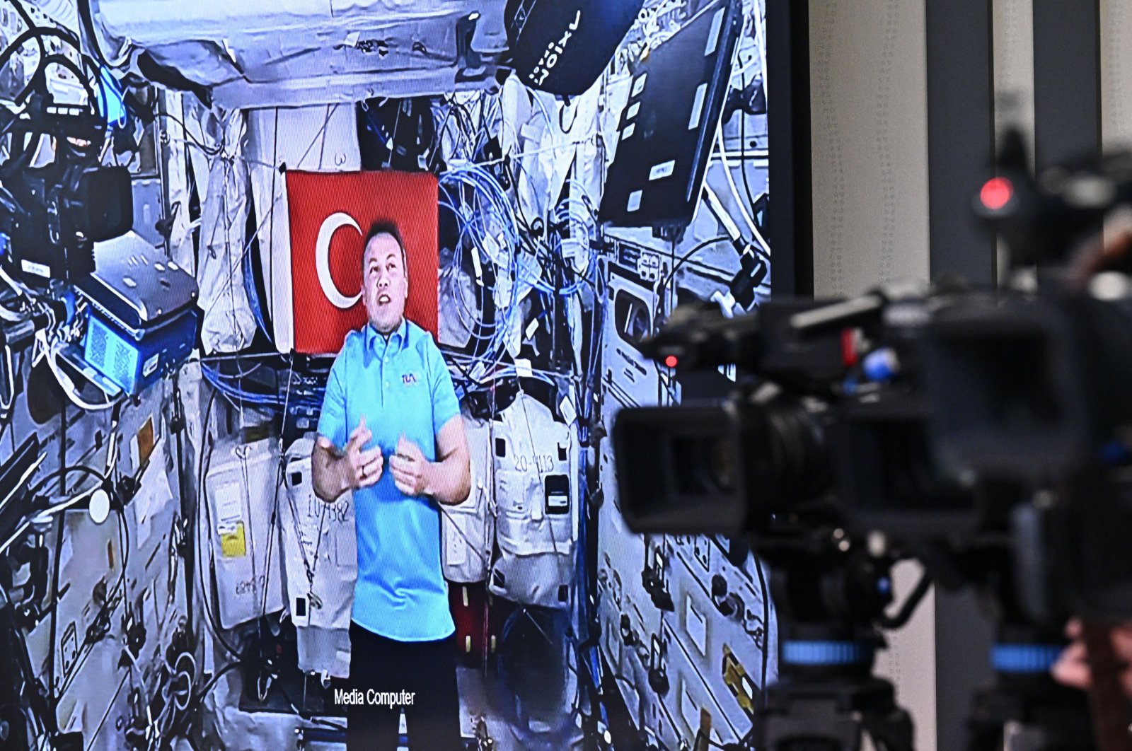 Alper Gezeravcı, at the International Space Station, is seen on a screen during a meeting with journalists, Ankara, Türkiye, Jan. 28, 2024. (AA Photo)