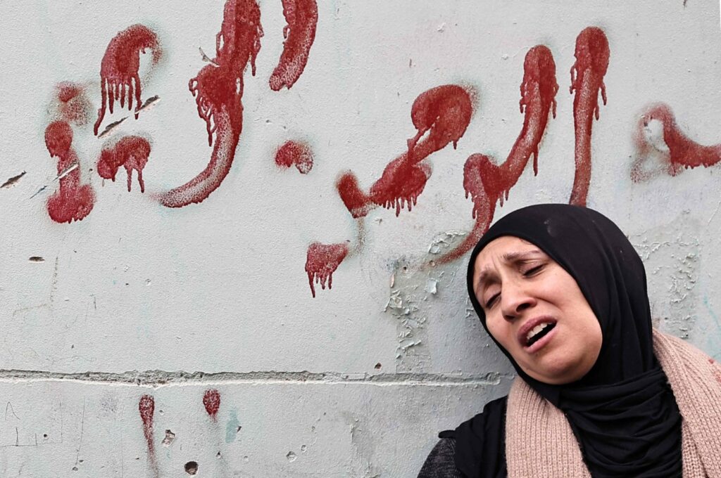 The mother of one of the Palestinians killed by undercover Israeli agents mourns during their funeral, occupied West Bank, Palestine, Jan. 30, 2024. (AFP Photo)
