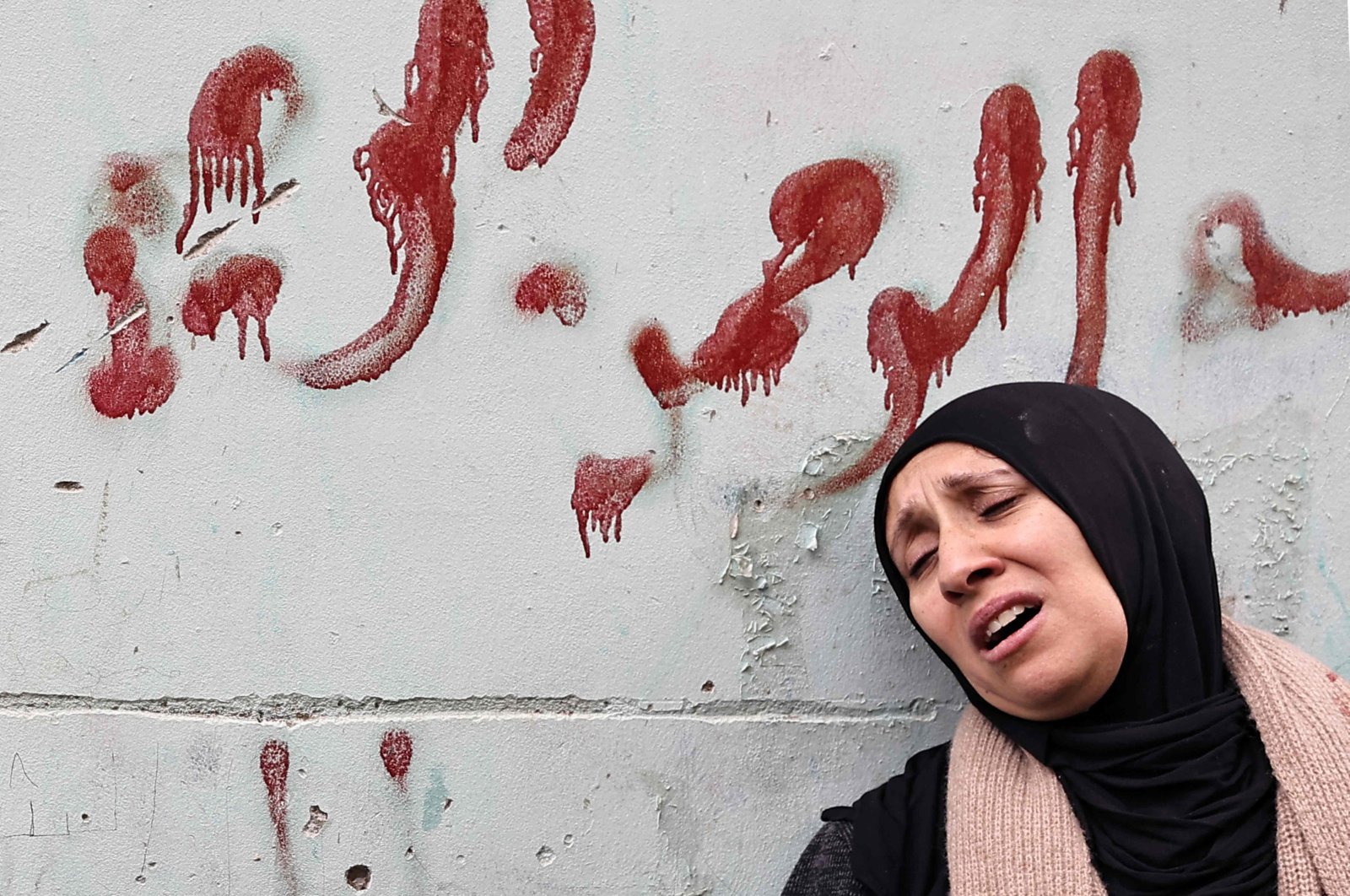 The mother of one of the Palestinians killed by undercover Israeli agents mourns during their funeral, occupied West Bank, Palestine, Jan. 30, 2024. (AFP Photo)